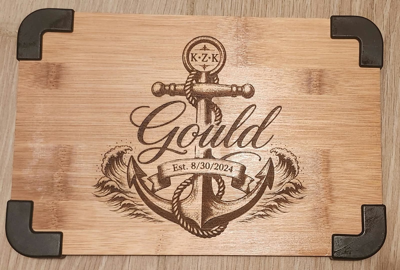Board engraved with an anchor and the Gould family name