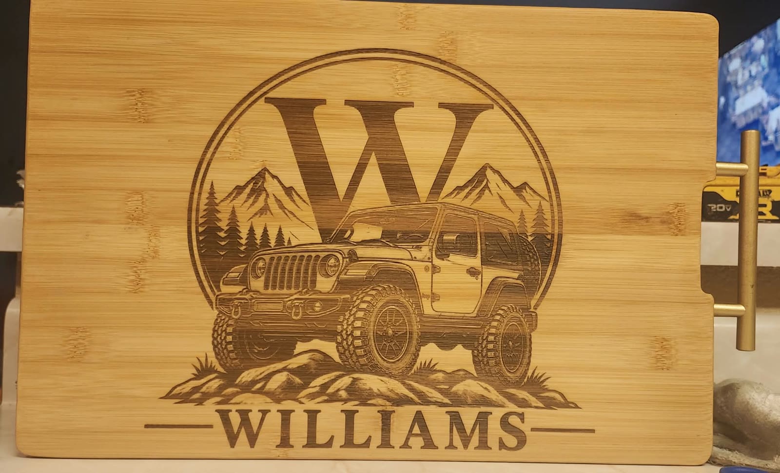 Board engraved with a W monogram, an off-road jeep, and WILLIAMS