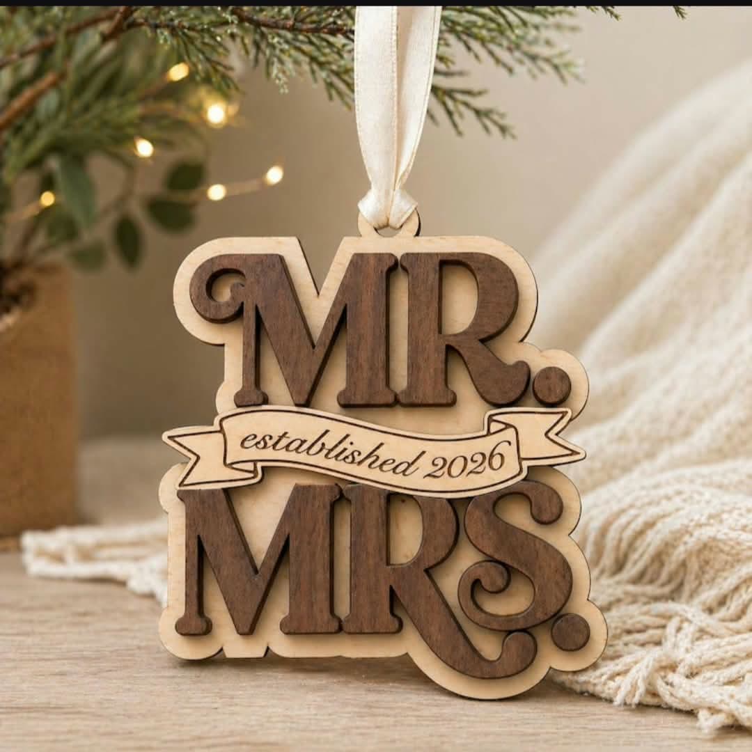 Layered wood ornament reading Mr. and Mrs., established 2026